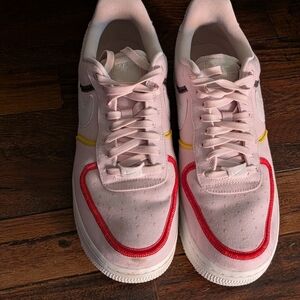 Nike Pink and Red Sneakers with Yellow Accents
